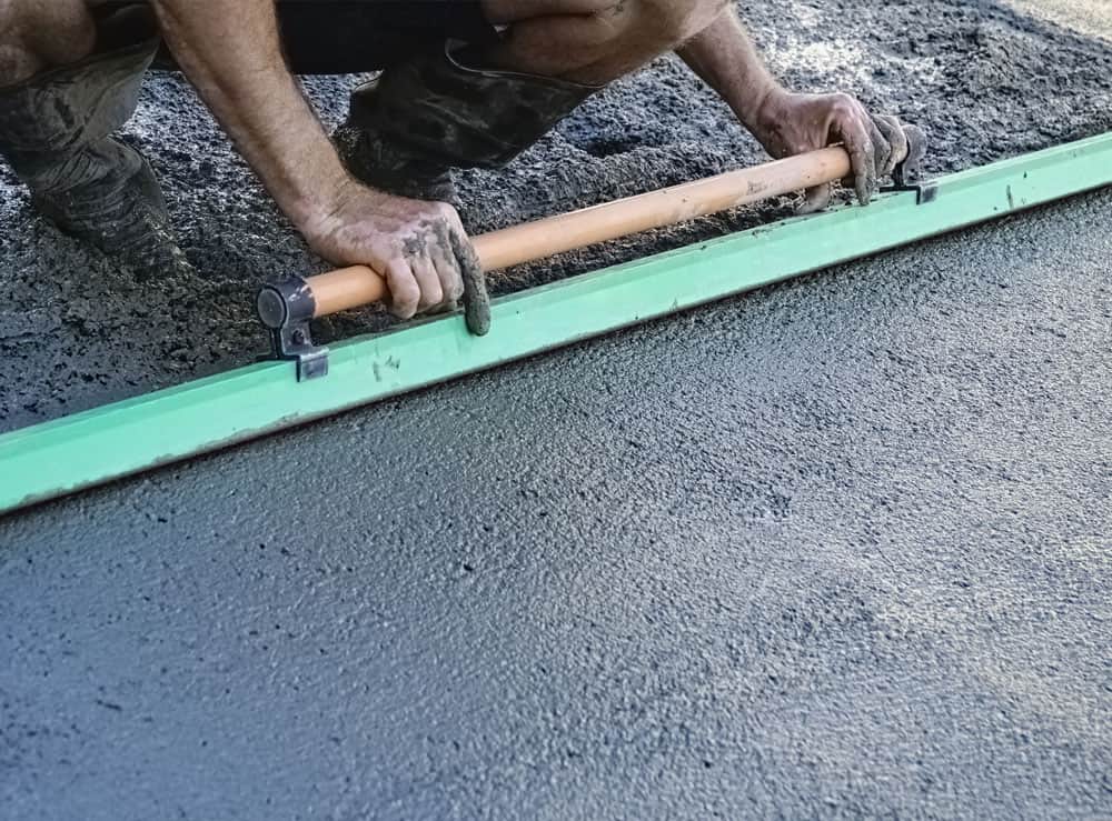 Photo showing the laying of concrete base on a driveway in croydon