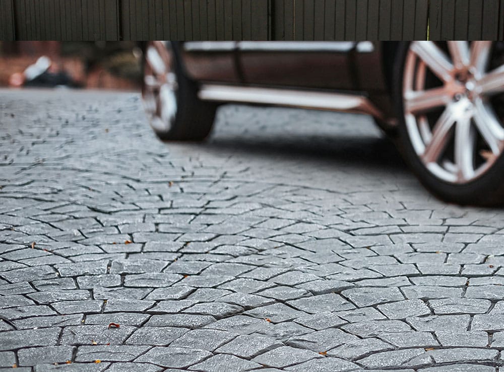 Imprinted Concrete Driveway with Car Photo showing an example of an imprinted concrete driveway in croydon with Car on it